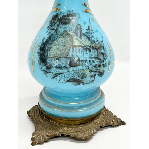 265 - A large Late 19th Century French opaline glass oil lamp. 71cm