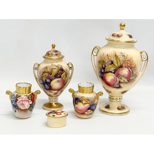 346 - A collection of Aynsley ‘Orchard Gold’ including a signed urn with lid by D. Jones 14x23cm. An N. Br... 