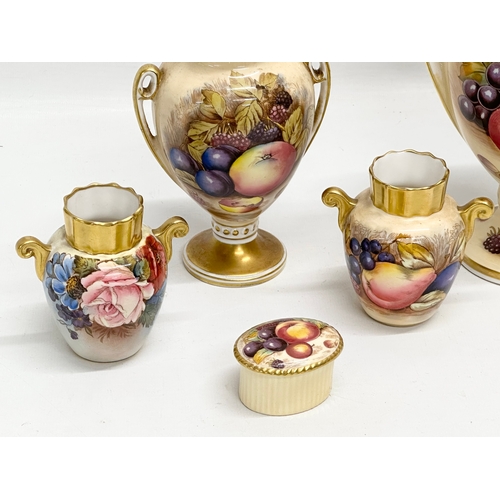 346 - A collection of Aynsley ‘Orchard Gold’ including a signed urn with lid by D. Jones 14x23cm. An N. Br... 