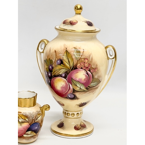 346 - A collection of Aynsley ‘Orchard Gold’ including a signed urn with lid by D. Jones 14x23cm. An N. Br... 