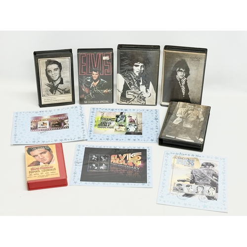 584 - A collection of Elvis Presley memorabilia. Including VHS tapes and stamps etc.