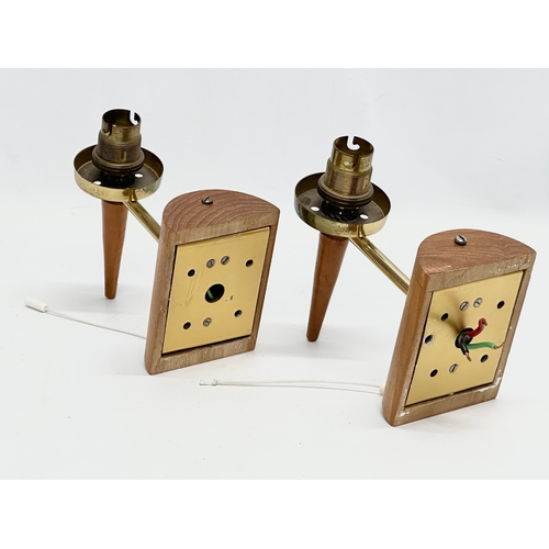 117I - A pair of Mid Century teak and brass wall lights with glass shades.