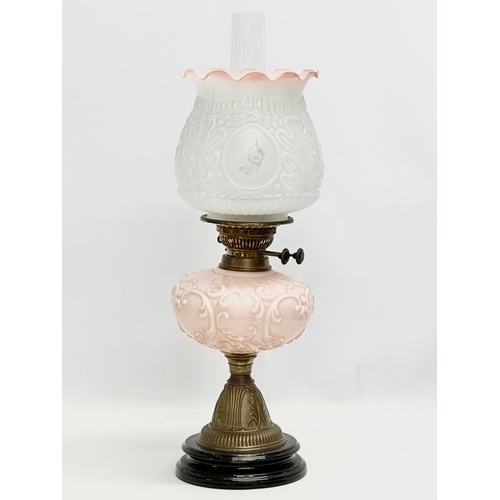 353 - A Victorian double burner oil lamp with glass bowl and an Early 20th Century shade. 58cm