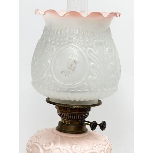 353 - A Victorian double burner oil lamp with glass bowl and an Early 20th Century shade. 58cm