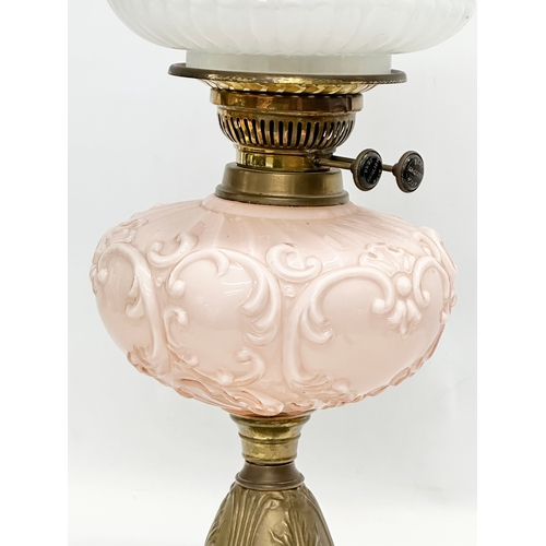 353 - A Victorian double burner oil lamp with glass bowl and an Early 20th Century shade. 58cm