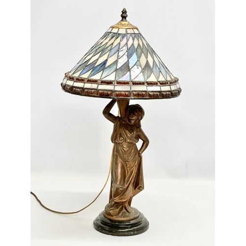 354 - An Early 20th Century speltre table lamp on marble base. With Tiffany style shade. 30x59cm