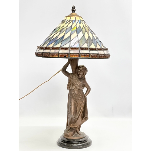 354 - An Early 20th Century speltre table lamp on marble base. With Tiffany style shade. 30x59cm