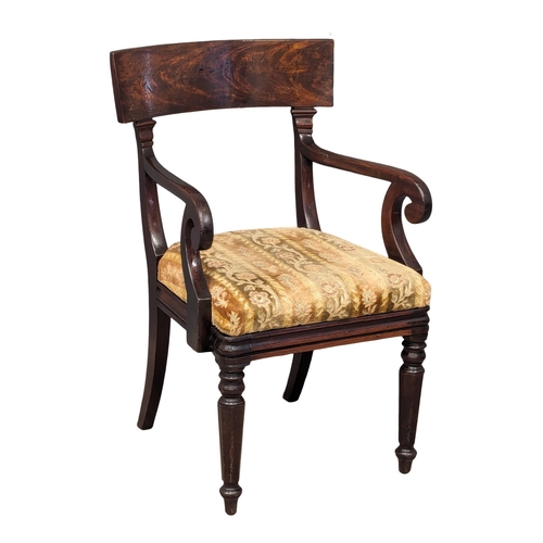 1179 - A George IV mahogany bar back armchair.(1)