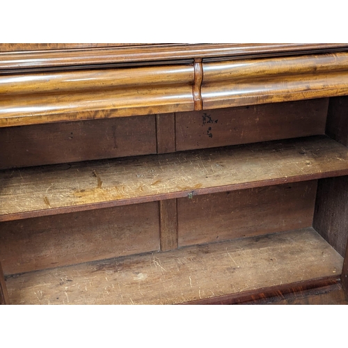 1183 - An ornate Early Victorian mahogany bookcase. Circa 1840-50. 154x43x238cm