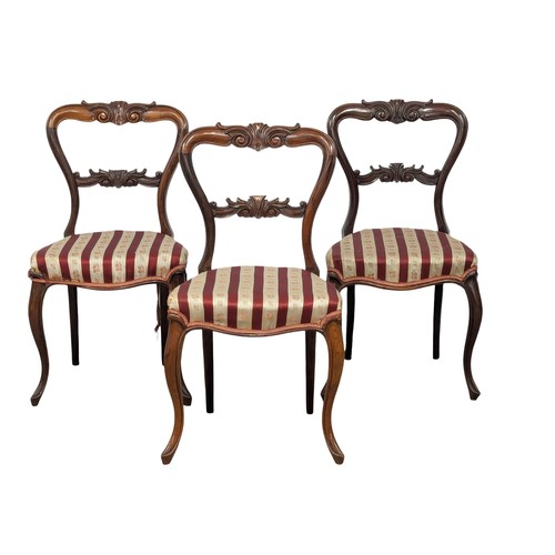 1184 - A set of 3 Victorian rosewood balloon back chairs on Cabriole legs