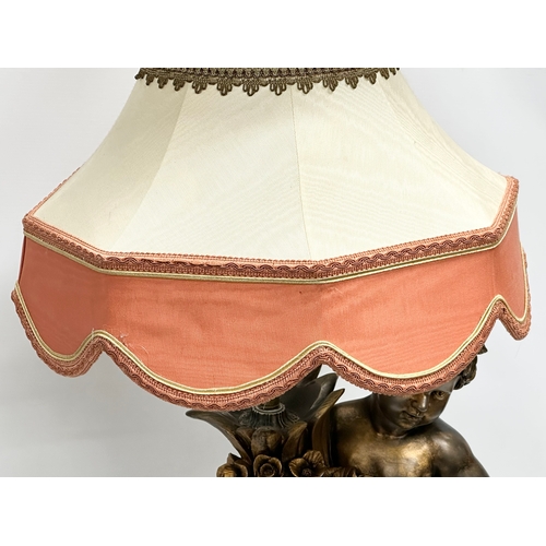 560 - A large gilt painted figurine table lamp. 89cm