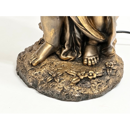 560 - A large gilt painted figurine table lamp. 89cm