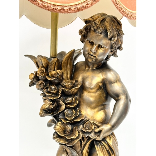 560 - A large gilt painted figurine table lamp. 89cm