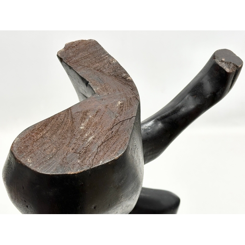 551 - A large Early/Mid 20th Century carved ebonised padauk sculpture. In the style of Henry Moore. 60cm