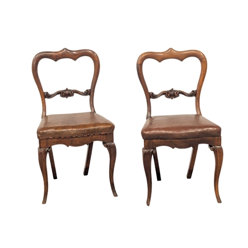 1185 - A pair of Victorian mahogany balloon back chairs on Cabriole legs.(4)