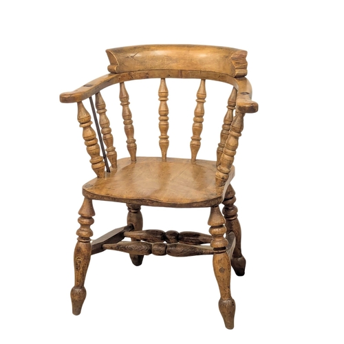 1186 - A Victorian elm and beech armchair / elbow chair.(4)