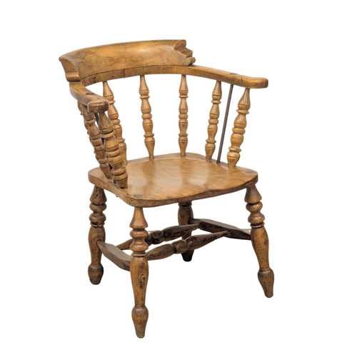 1186 - A Victorian elm and beech armchair / elbow chair.(4)