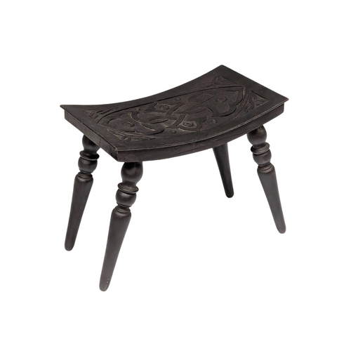 1191 - An Early 20th Century carved stool with Celtic decoration.  34x28cm