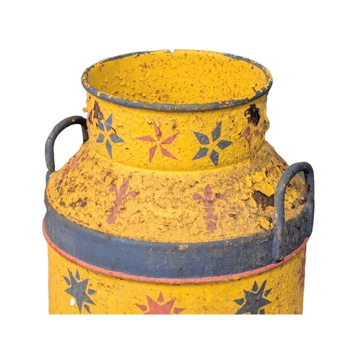 578 - A vintage painted milk churn. 66cm