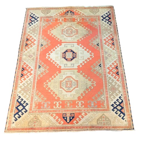 1193 - A large vintage Middle Eastern style hand knotted rug. 204x306cm