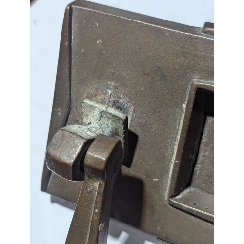 124 - An Art Deco letter slot door knocker. 1930. 23cm