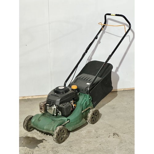 6 - A petrol lawnmower.