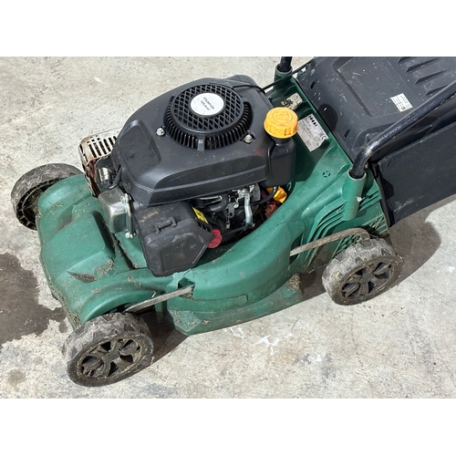 6 - A petrol lawnmower.