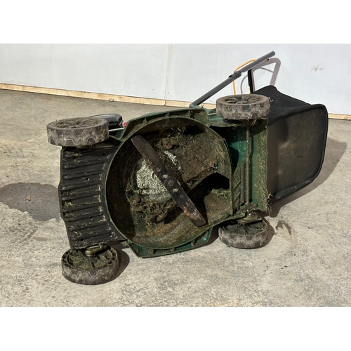 6 - A petrol lawnmower.