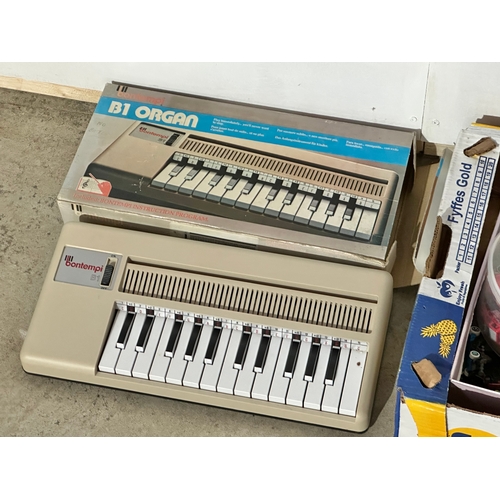 7 - A box of toys. A Bontempi B1 Organ with box. Toys cars, Battleship Commander.