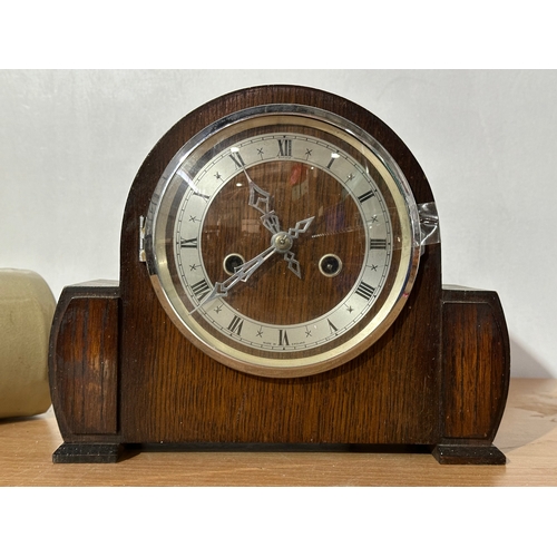 9 - A vintage Enfield mantle clock with key and pendulum. Together with a stone water bottle