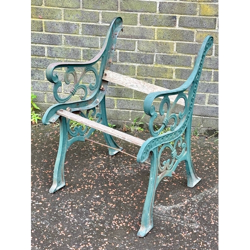 12 - A cast iron garden seat/bench ends.