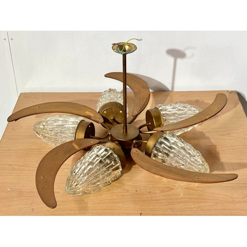 25 - A large Mid Century teak ceiling light with glass shades. 70x35cm.