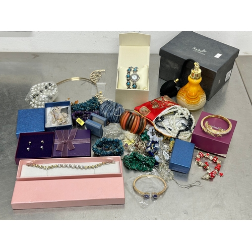 52 - A quantity of costume jewellery. Perfume bottle, watch etc