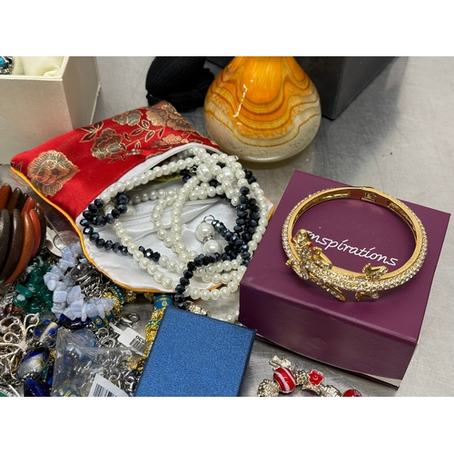 52 - A quantity of costume jewellery. Perfume bottle, watch etc