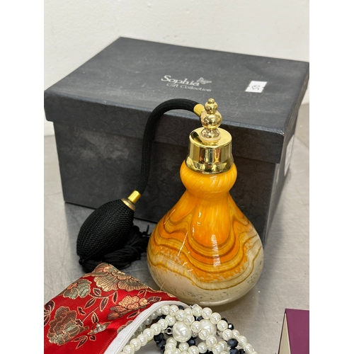 52 - A quantity of costume jewellery. Perfume bottle, watch etc