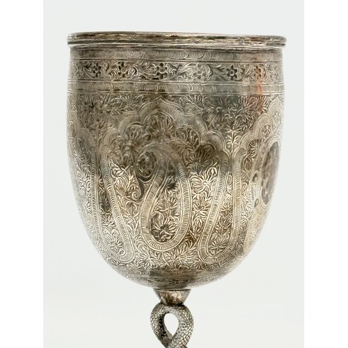 1 - A pair of Late 19th Century Anglo-Indian Kutch silver goblets. With twist serpent stems on raised ci... 