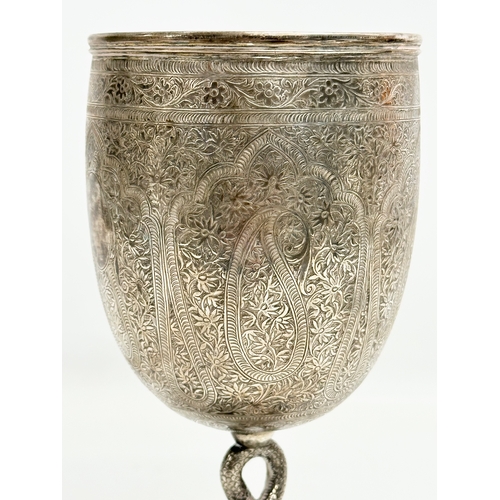 1 - A pair of Late 19th Century Anglo-Indian Kutch silver goblets. With twist serpent stems on raised ci... 