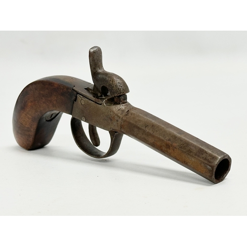 106 - An Early 19th Century percussion boxlock pocket pistol. 18cm