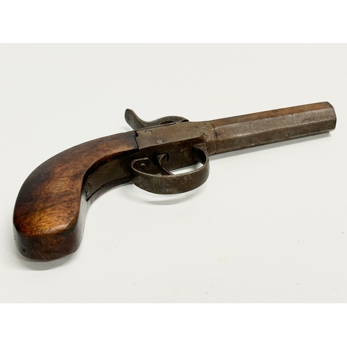 106 - An Early 19th Century percussion boxlock pocket pistol. 18cm