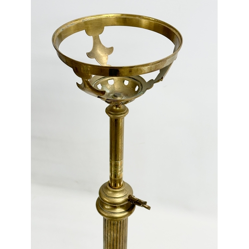 63 - A large Victorian telescopic double burner oil lamp with ruby glass bowl, reeded column and Early 20... 