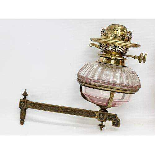 65 - A pair of Victorian wall bracket double burner oil lamps with slice cut bowls. 30x27cm