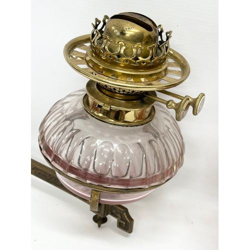 65 - A pair of Victorian wall bracket double burner oil lamps with slice cut bowls. 30x27cm