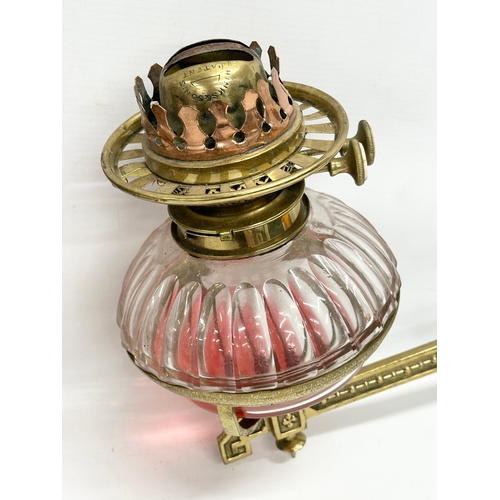 65 - A pair of Victorian wall bracket double burner oil lamps with slice cut bowls. 30x27cm