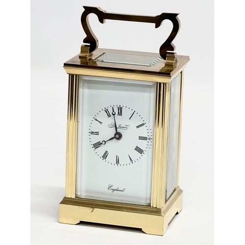 401 - A St James brass carriage clock.