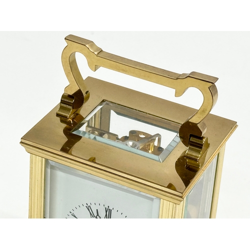 401 - A St James brass carriage clock.