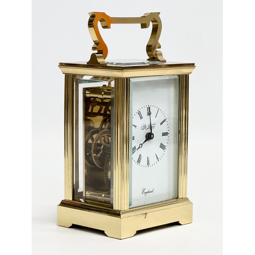 401 - A St James brass carriage clock.