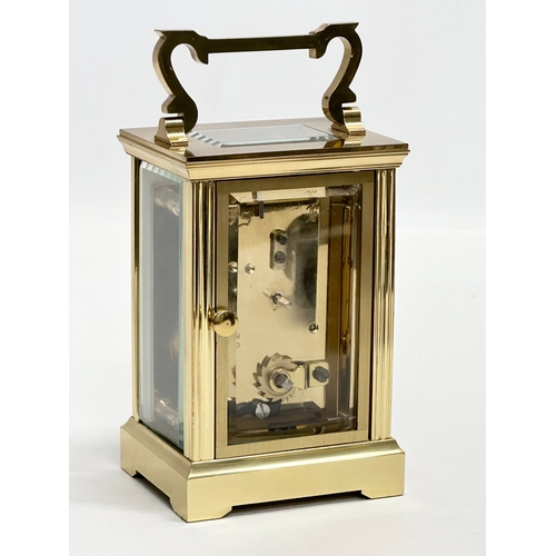 401 - A St James brass carriage clock.