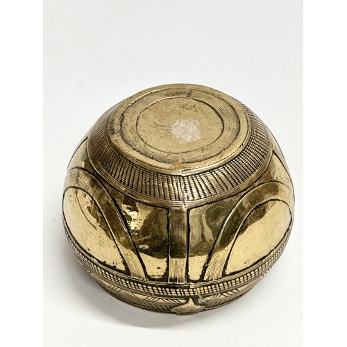 181 - An Early 20th Century Indian brass rice measuring bowl. 13x11cm.