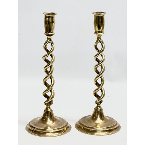 428 - A pair of large Mid 20th Century brass barely twist candlesticks. 29cm