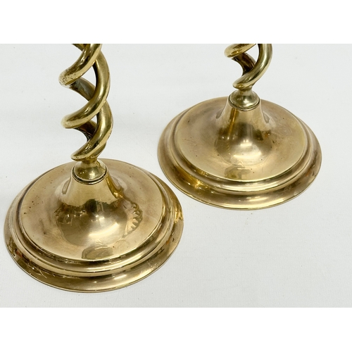 428 - A pair of large Mid 20th Century brass barely twist candlesticks. 29cm